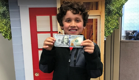 boy holding money