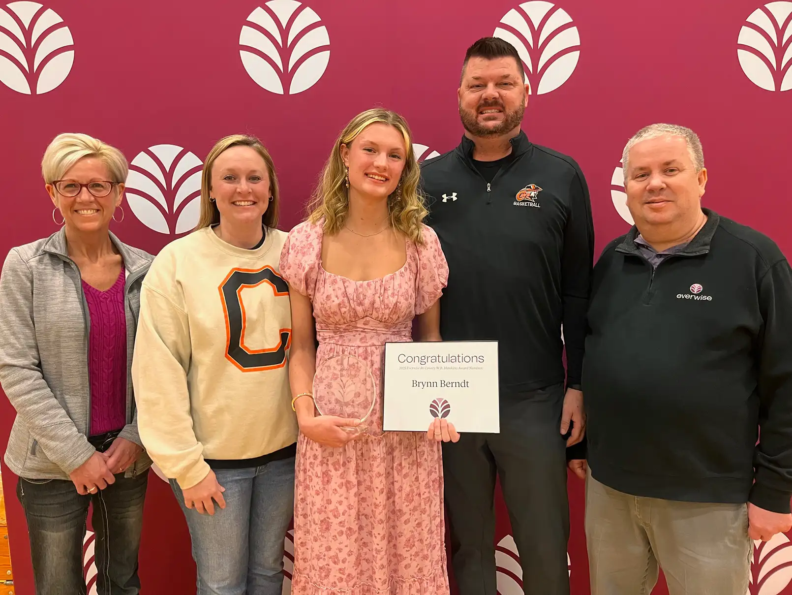 Brunn Berndt poses with her parents and Everwise staff