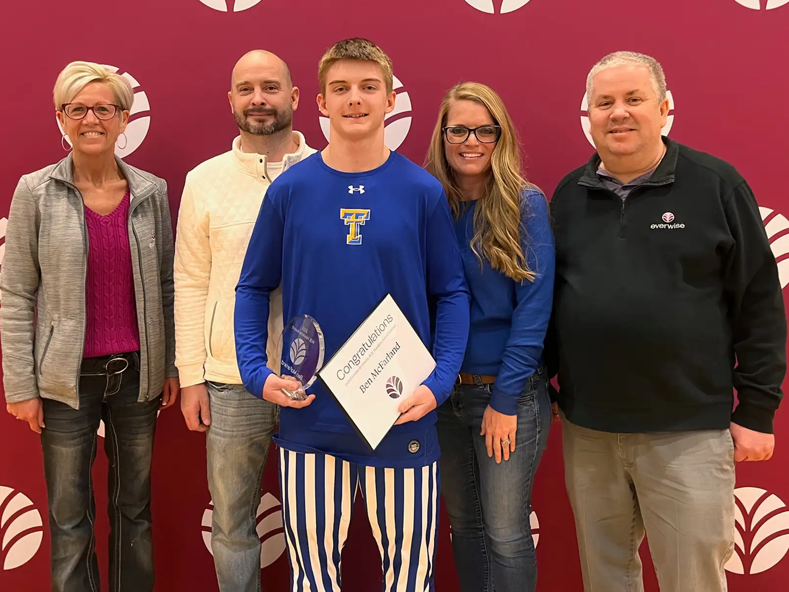 Ben McFarland poses with his parents and Everwise staff